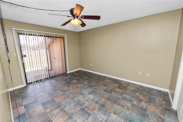 empty room with a textured ceiling and ceiling fan