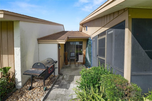 property entrance featuring a patio area