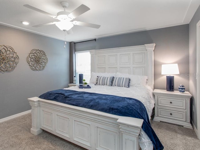 bedroom with light colored carpet and ceiling fan