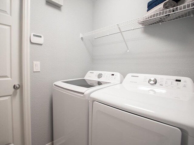 laundry area featuring washing machine and dryer