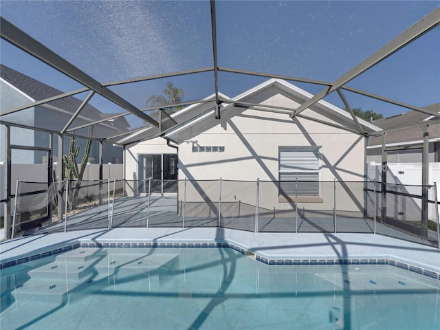 view of swimming pool with a lanai