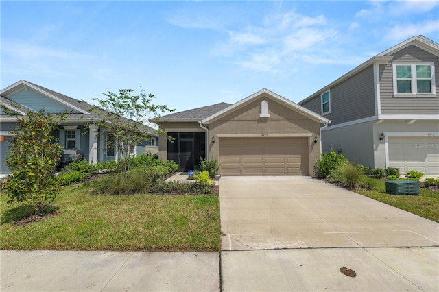 view of front facade featuring a garage and a front yard