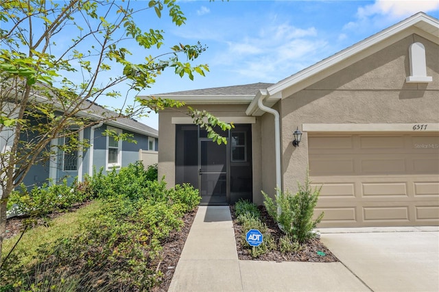 property entrance featuring a garage