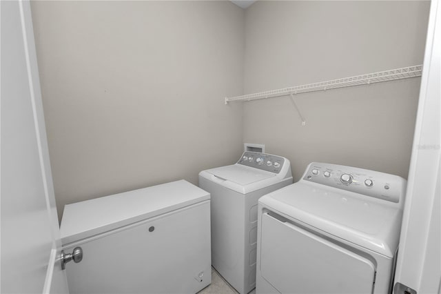 laundry area with washer and dryer