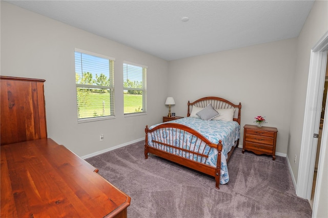 carpeted bedroom featuring a textured ceiling