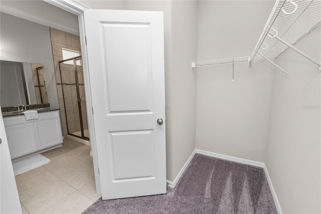 walk in closet featuring light tile patterned floors