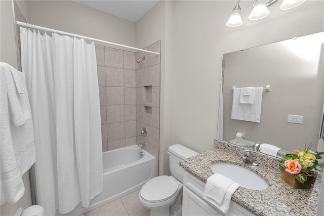 full bathroom with tile patterned floors, shower / bath combo, toilet, and vanity