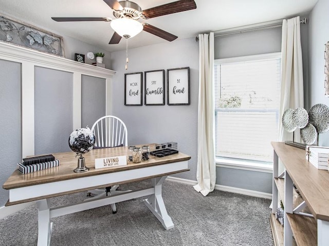 carpeted home office with ceiling fan