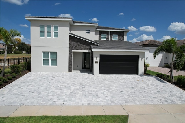 view of front of property with a garage