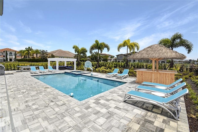 view of swimming pool with an in ground hot tub, a gazebo, a pergola, and a patio area