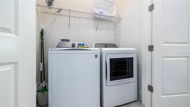 laundry area with washer and clothes dryer