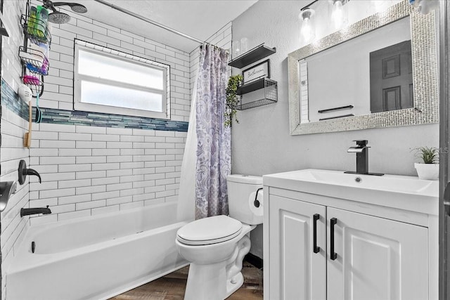 full bathroom with hardwood / wood-style floors, toilet, vanity, and shower / bath combo