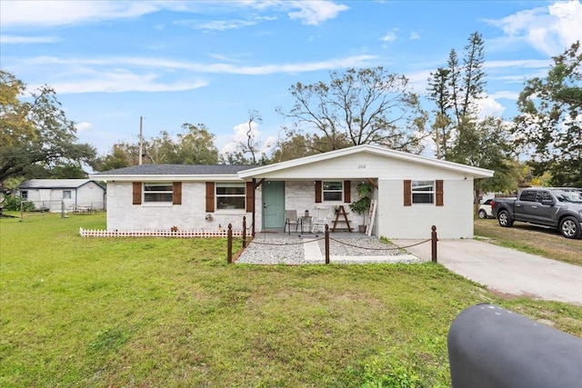 single story home featuring a front lawn and covered porch