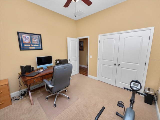 office with ceiling fan and light colored carpet