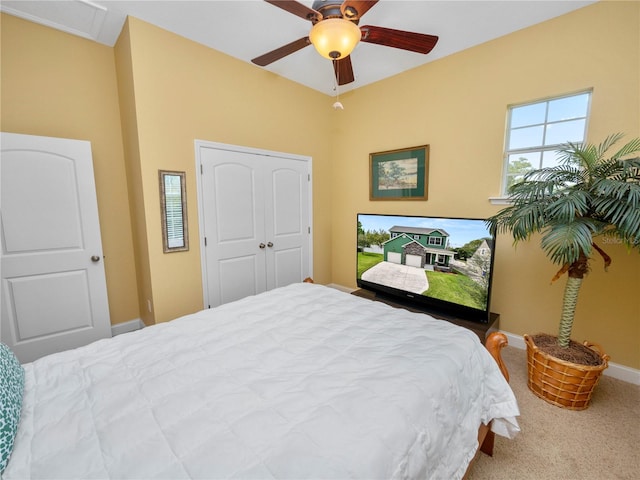 bedroom featuring a closet, carpet flooring, and ceiling fan