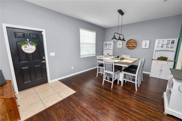 dining area with dark hardwood / wood-style flooring