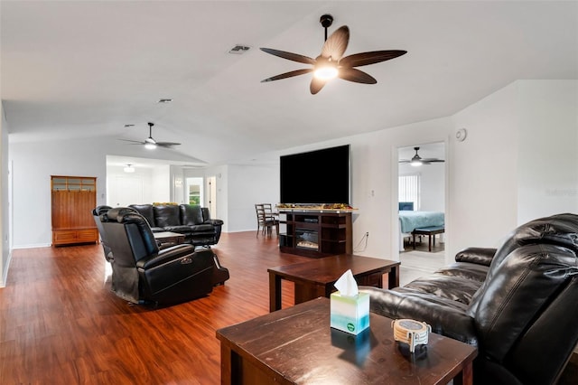 living room featuring hardwood / wood-style floors, plenty of natural light, and lofted ceiling