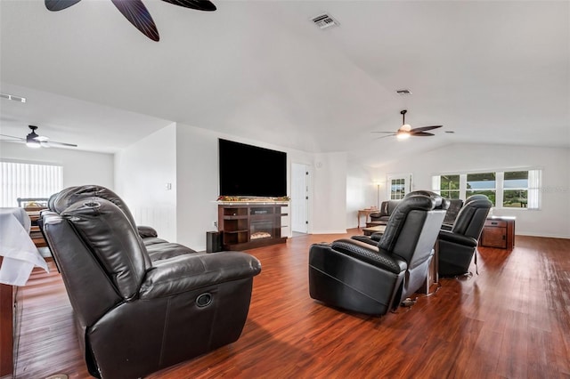 living room with dark hardwood / wood-style floors and lofted ceiling