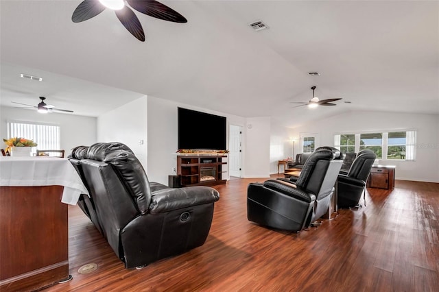 living room with lofted ceiling and dark wood-type flooring