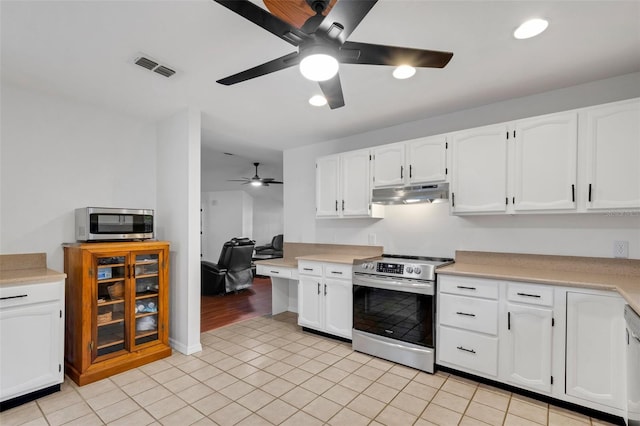 kitchen featuring white cabinets, light tile patterned floors, stainless steel appliances, and ceiling fan