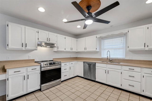 kitchen featuring white cabinets, sink, ceiling fan, light tile patterned flooring, and stainless steel appliances