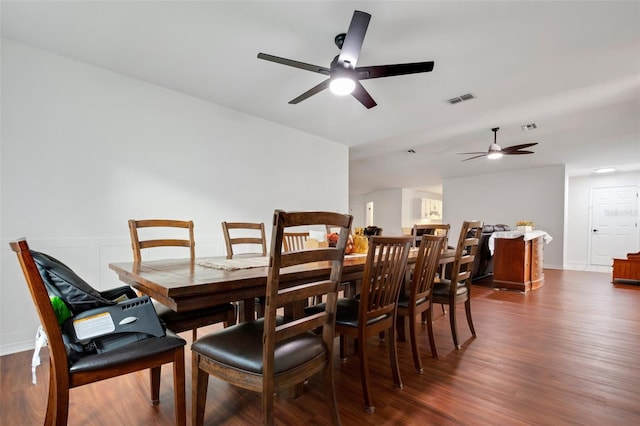 dining area featuring ceiling fan and dark hardwood / wood-style floors