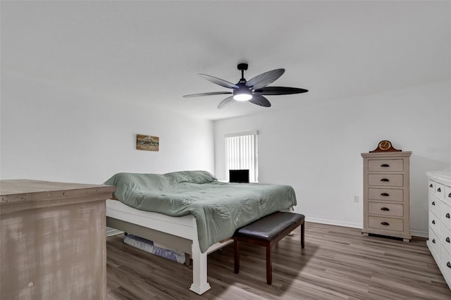 bedroom with ceiling fan and light hardwood / wood-style flooring