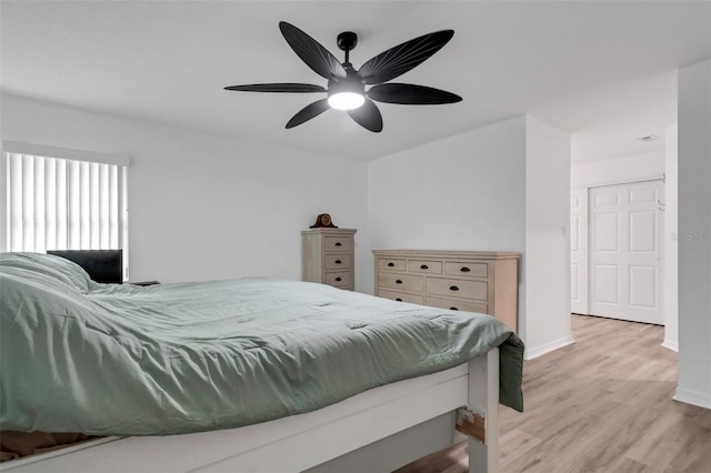 bedroom with light wood-type flooring and ceiling fan