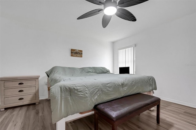 bedroom with light wood-type flooring and ceiling fan