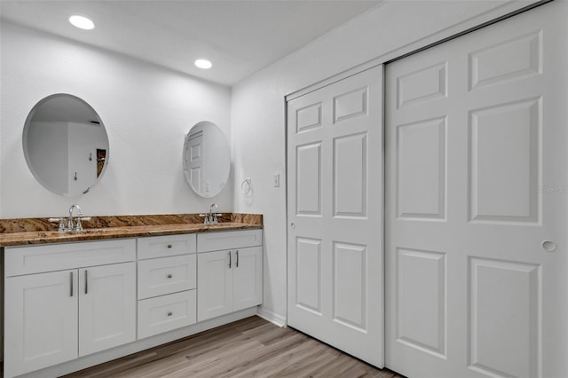 bathroom featuring vanity and hardwood / wood-style flooring