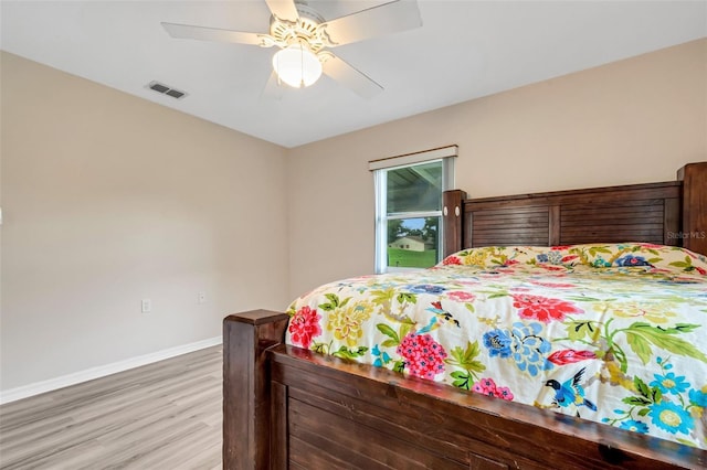 bedroom featuring ceiling fan and hardwood / wood-style floors