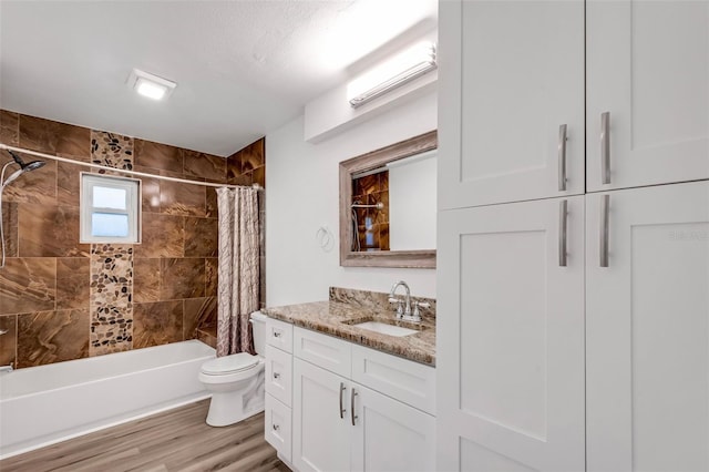 full bathroom with vanity, shower / bath combination with curtain, toilet, and wood-type flooring