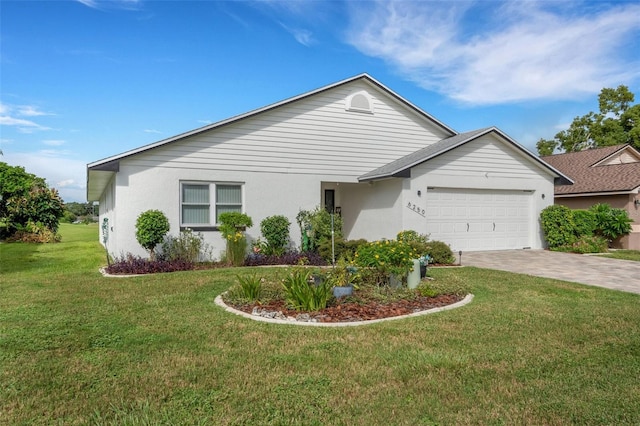 ranch-style home with a front yard and a garage