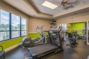 exercise room with a raised ceiling