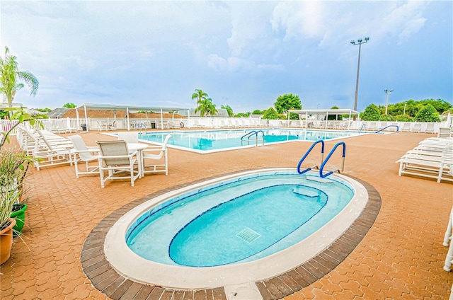 view of swimming pool with a patio area