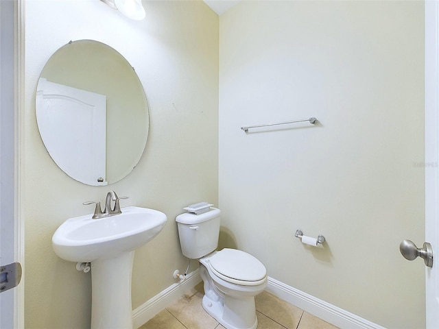 bathroom with tile patterned flooring and toilet