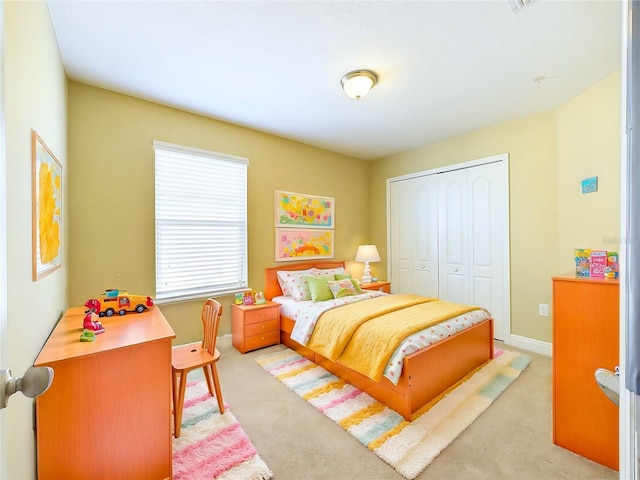 carpeted bedroom with a closet