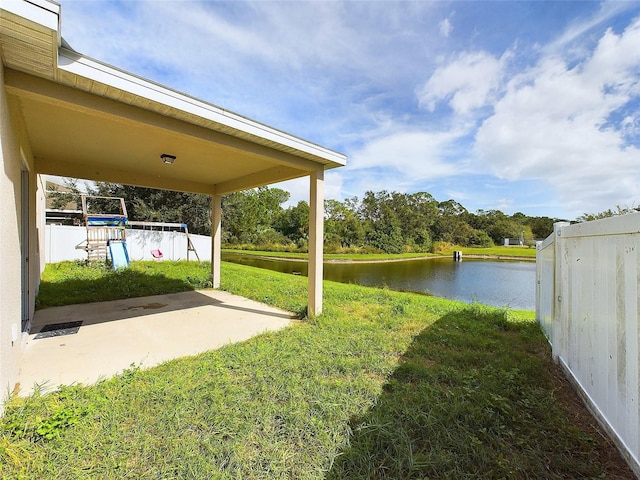 view of yard featuring a water view and a patio