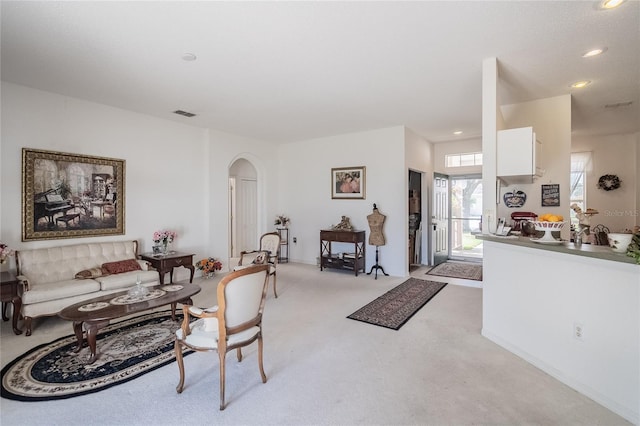 living room featuring light colored carpet