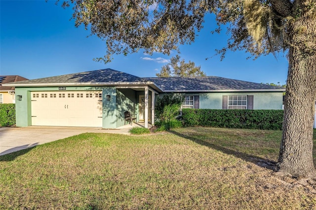 ranch-style house with a front lawn and a garage