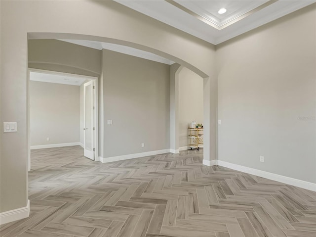 empty room with light parquet flooring and crown molding