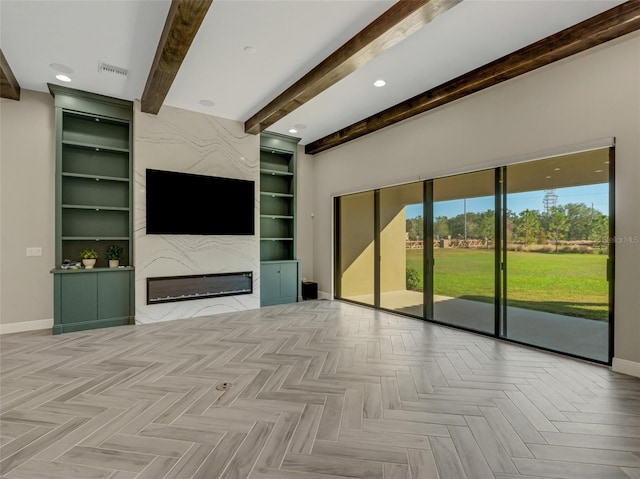 unfurnished living room featuring beamed ceiling, built in features, and light parquet floors