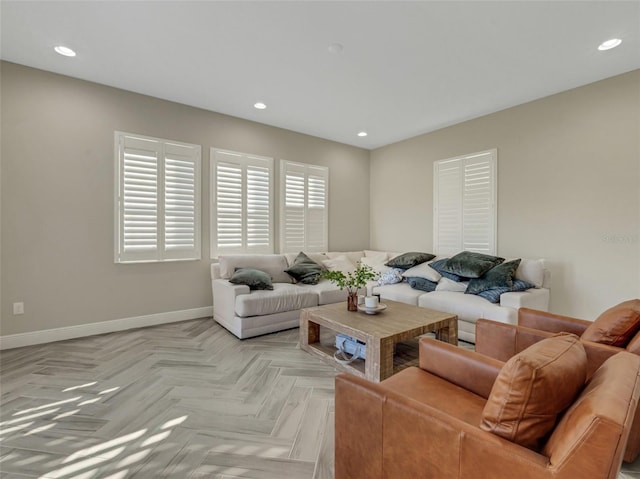 living room featuring plenty of natural light and light parquet flooring