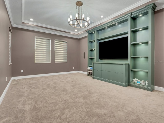 unfurnished living room featuring carpet, an inviting chandelier, and ornamental molding