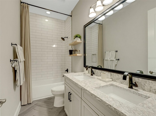 full bathroom featuring vanity, toilet, and shower / bath combo with shower curtain