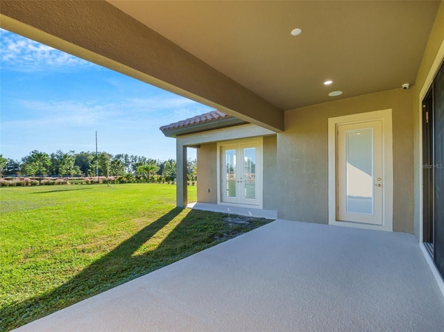 10469 Meadowrun Dr, Lithia, FL 33547 - view of patio / terrace featuring french doors