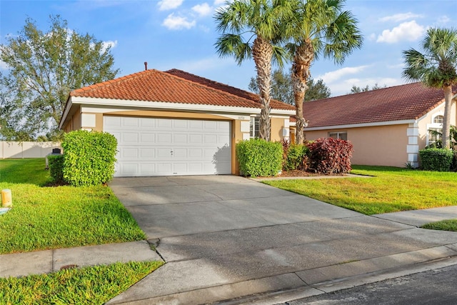 view of front facade with a front yard and a garage