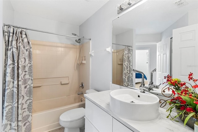 full bathroom featuring vanity, shower / bathtub combination with curtain, and toilet