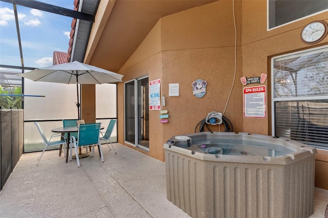 view of patio / terrace with a hot tub