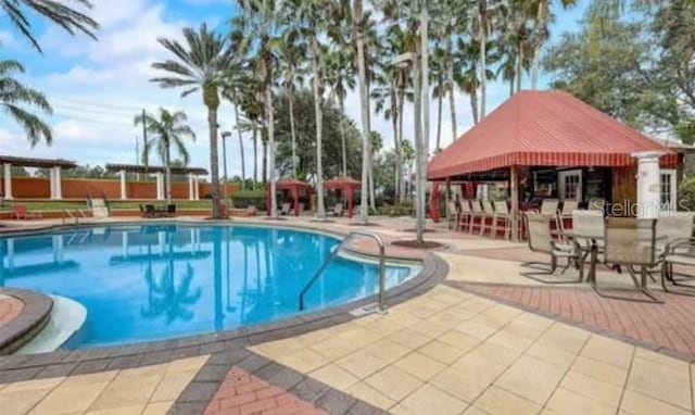 view of swimming pool featuring a gazebo and a patio